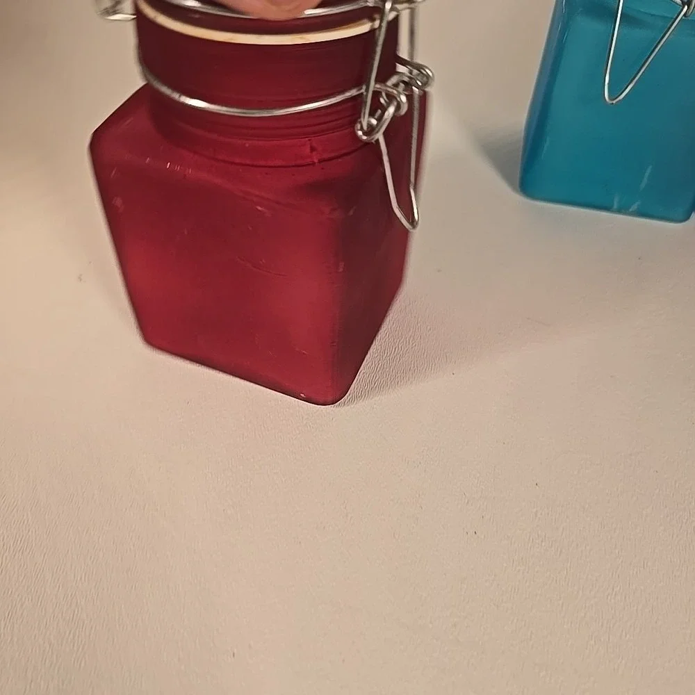 Set Of Four Colored‎ Glass Cannisters With Locking Tops Very Good Condition